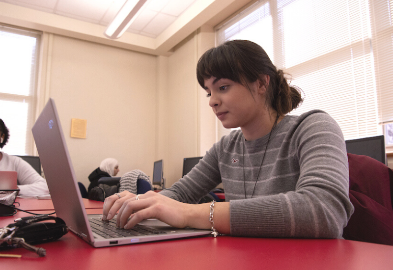 UIW Student with a laptop